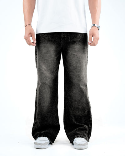 men wear black baggy denim jeans with center white sun blast with white shoes, watch and t-shirt