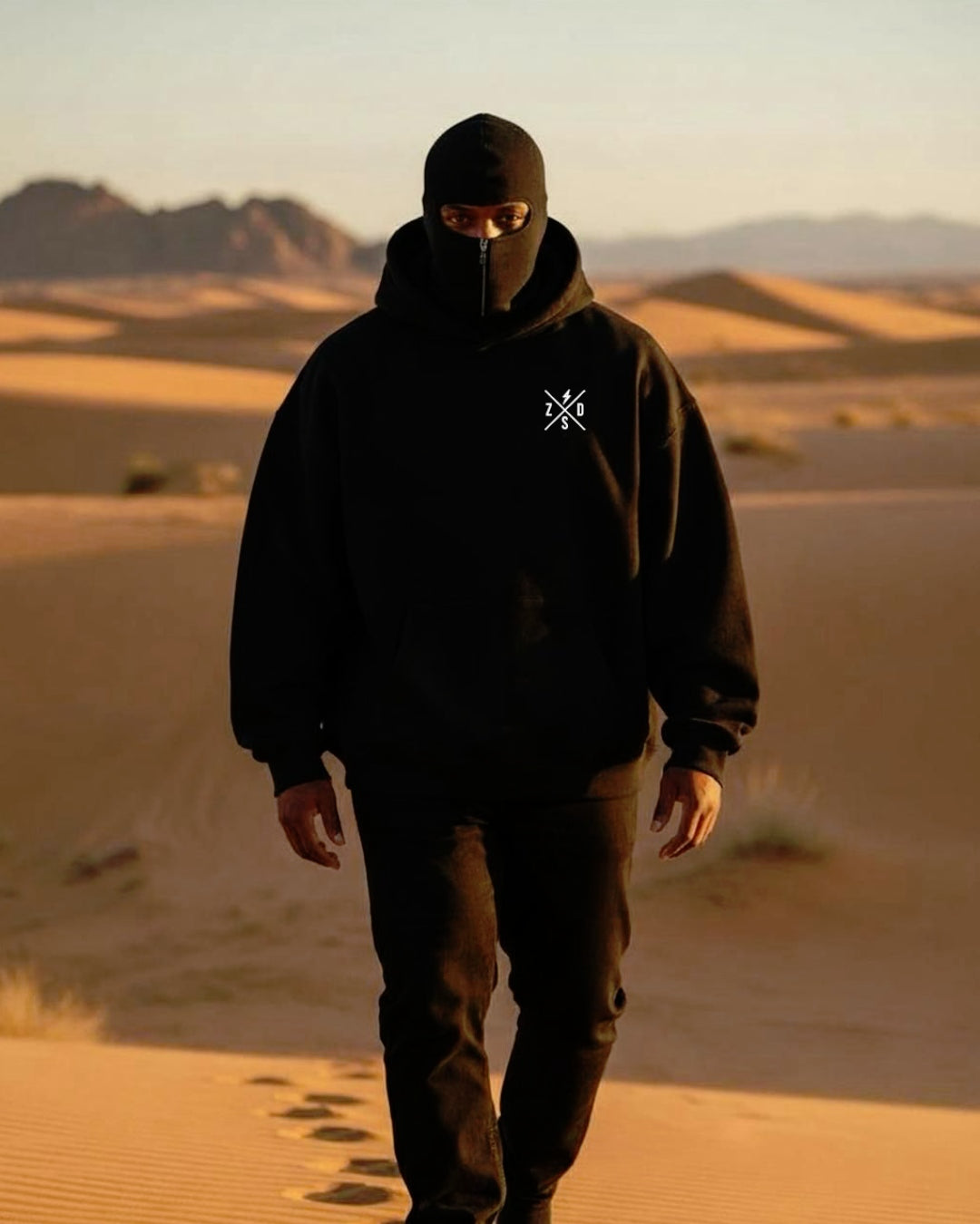 a men's walking in dubai desert and wear windter zip up balaclava ninja hoodie